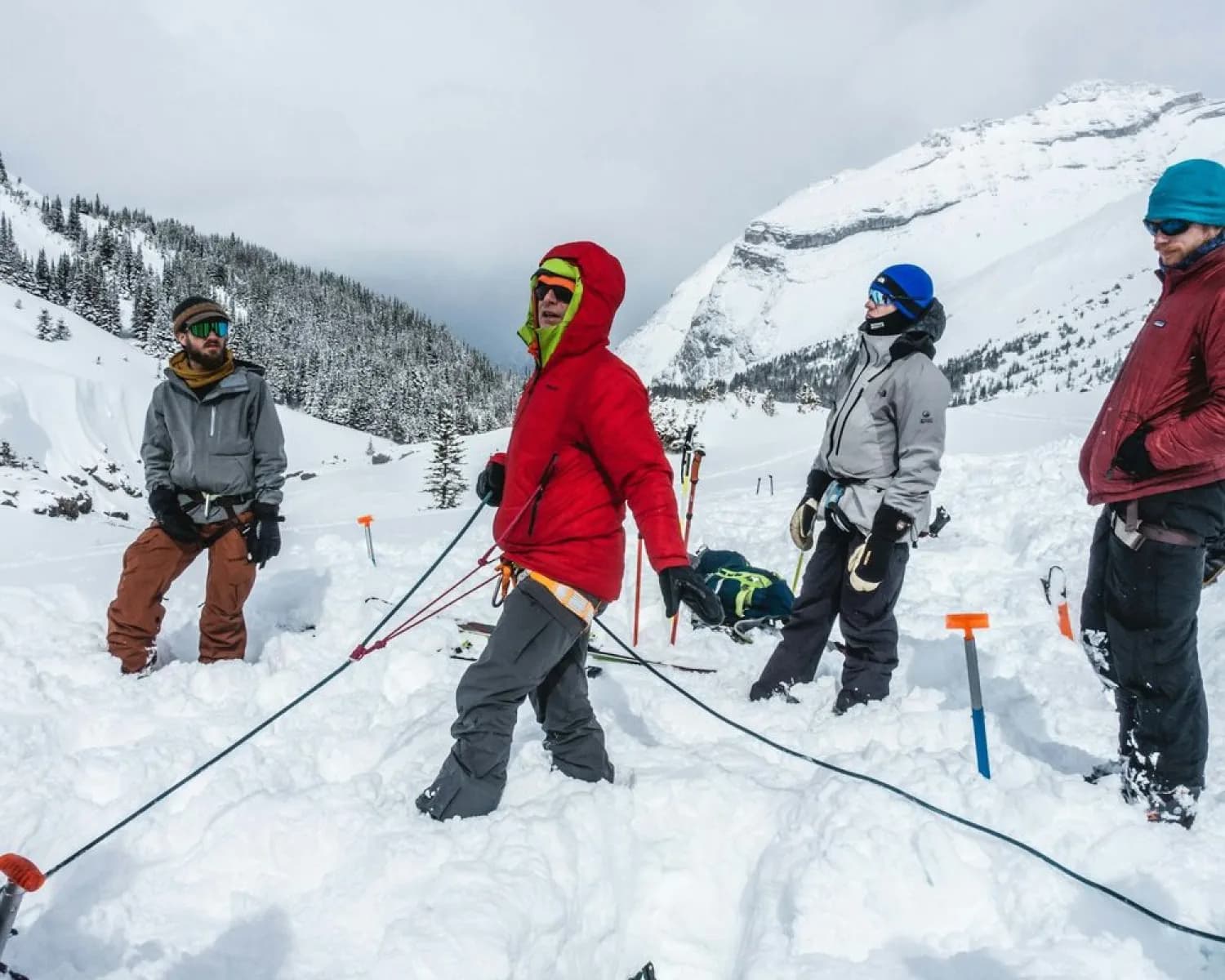 Trainees practising rope rescue in deep snow